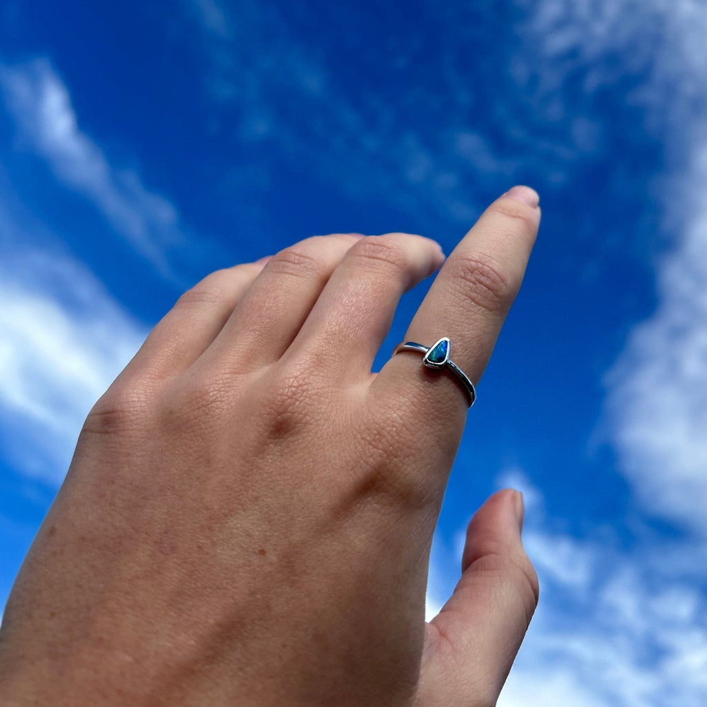 Opal ring on model hand