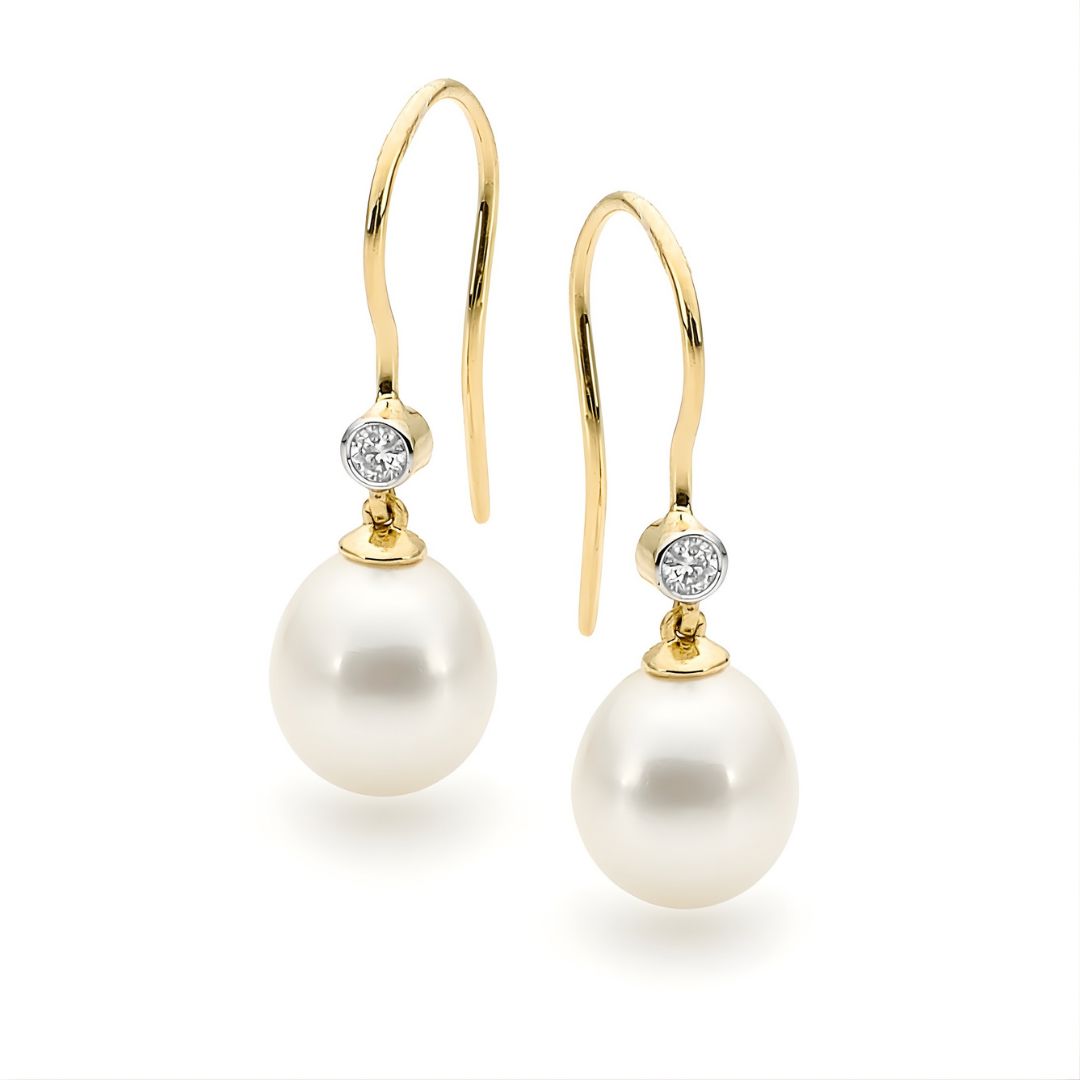 Gold earrings with pearls and diamonds on a white background | Ikecho Australia