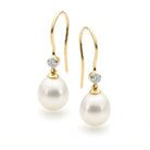 Gold earrings with pearls and diamonds on a white background | Ikecho Australia
